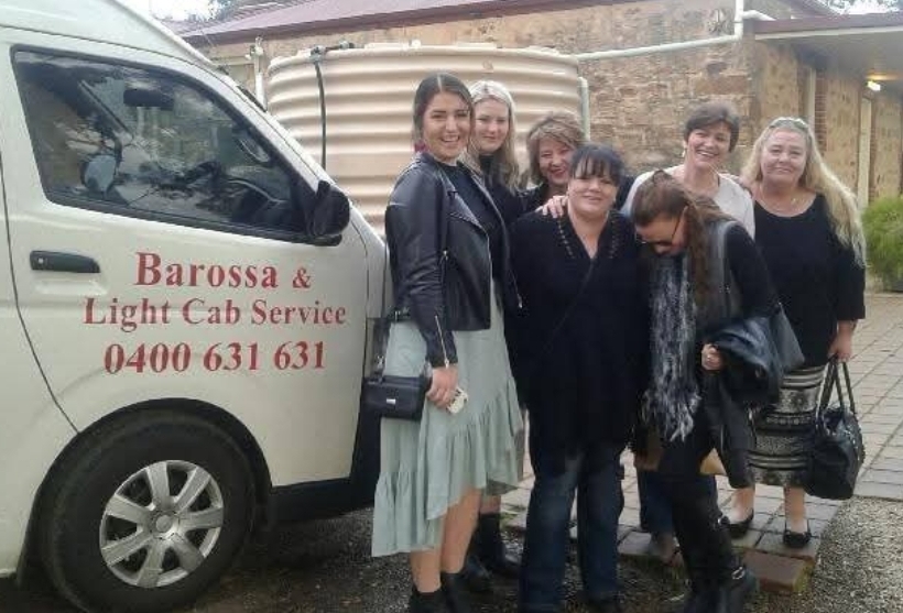 Group of happy travelers enjoying Barossa Valley tour